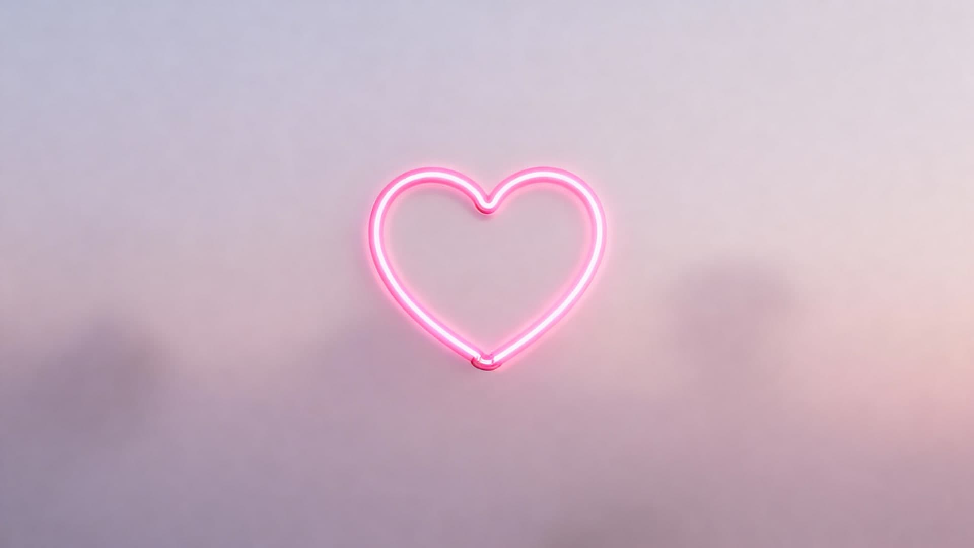 pink neon heart halo floating in soft blush haze, cinematic depth, desktop wallpaper, 16:9, 4k resolution, no mockup, no device frame, no ui, no text, no watermark, no status bar, no bezel, no phone screen, no clock, no icons, no notch, plain wallpaper, clean background