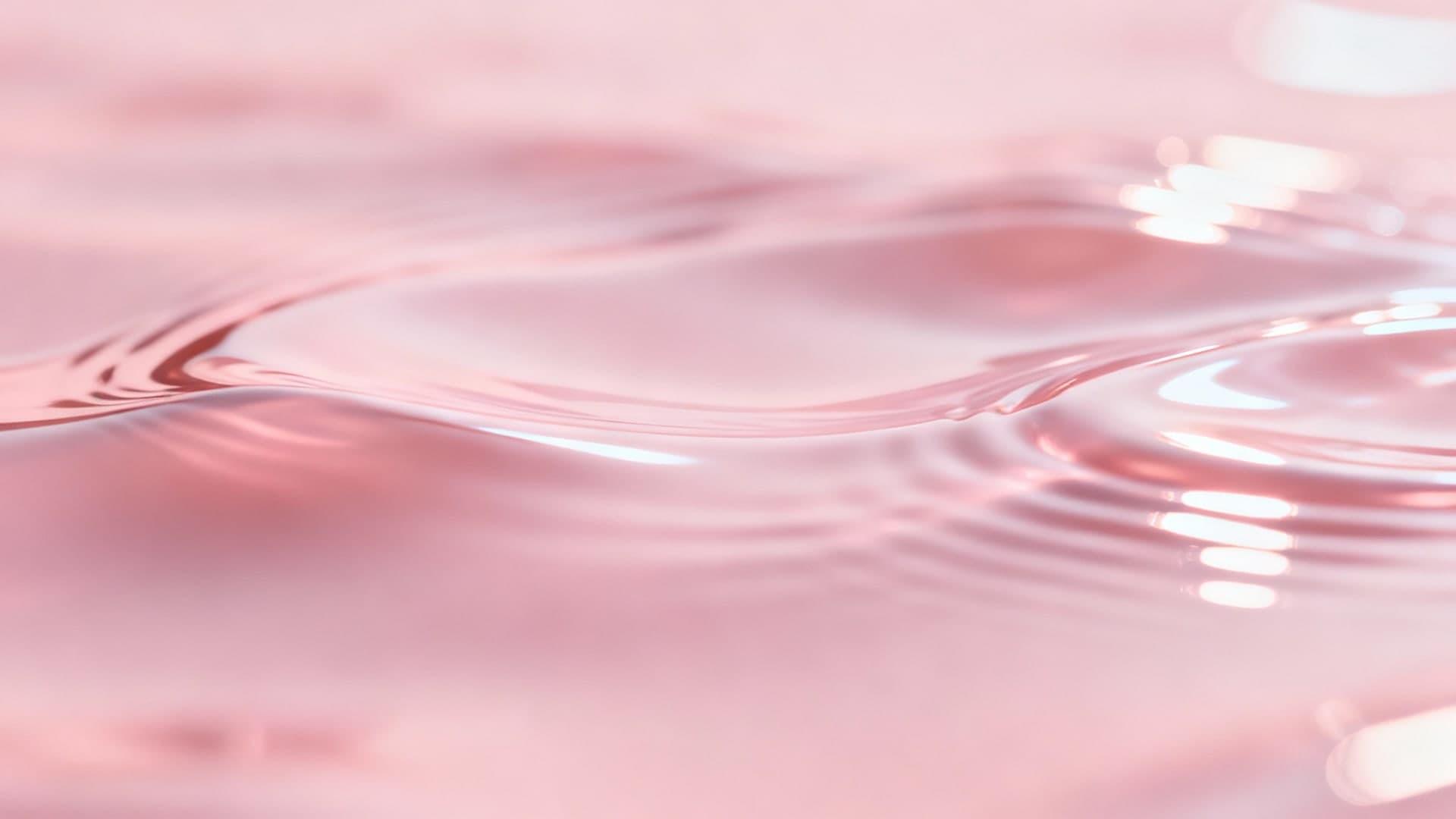 smooth pink glossy liquid surface with soft ripples
