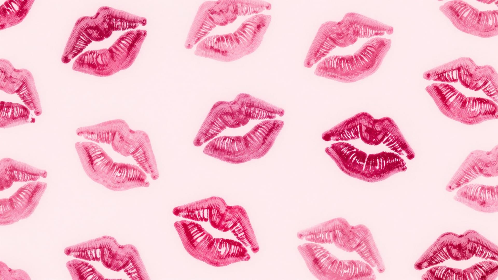 A repeating pattern of pink lipstick prints with playful texture.