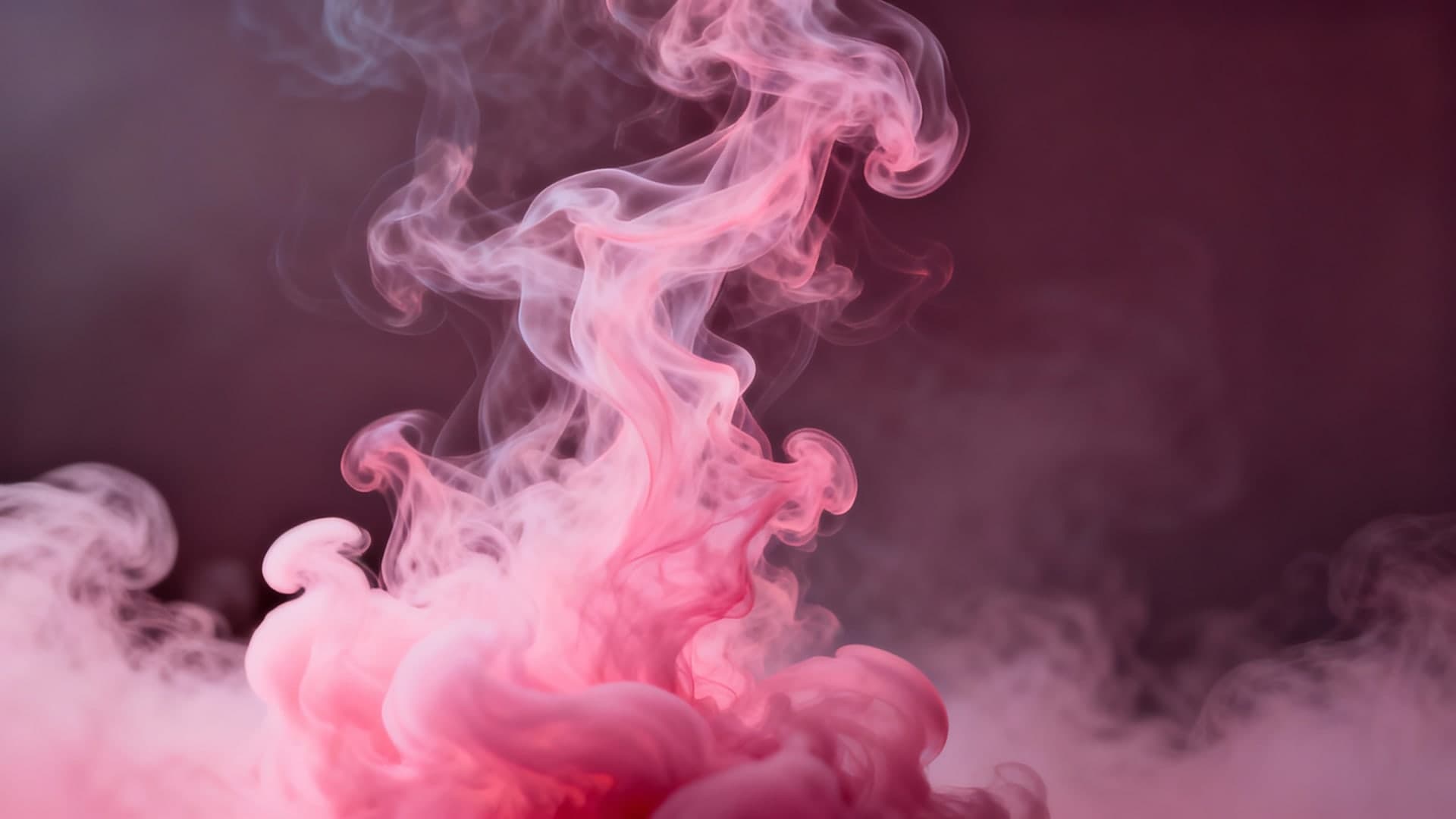dreamy pink smoke rising in soft swirling patterns