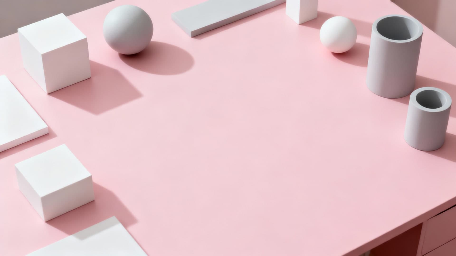 aesthetic pink desk setup with minimal geometric layout