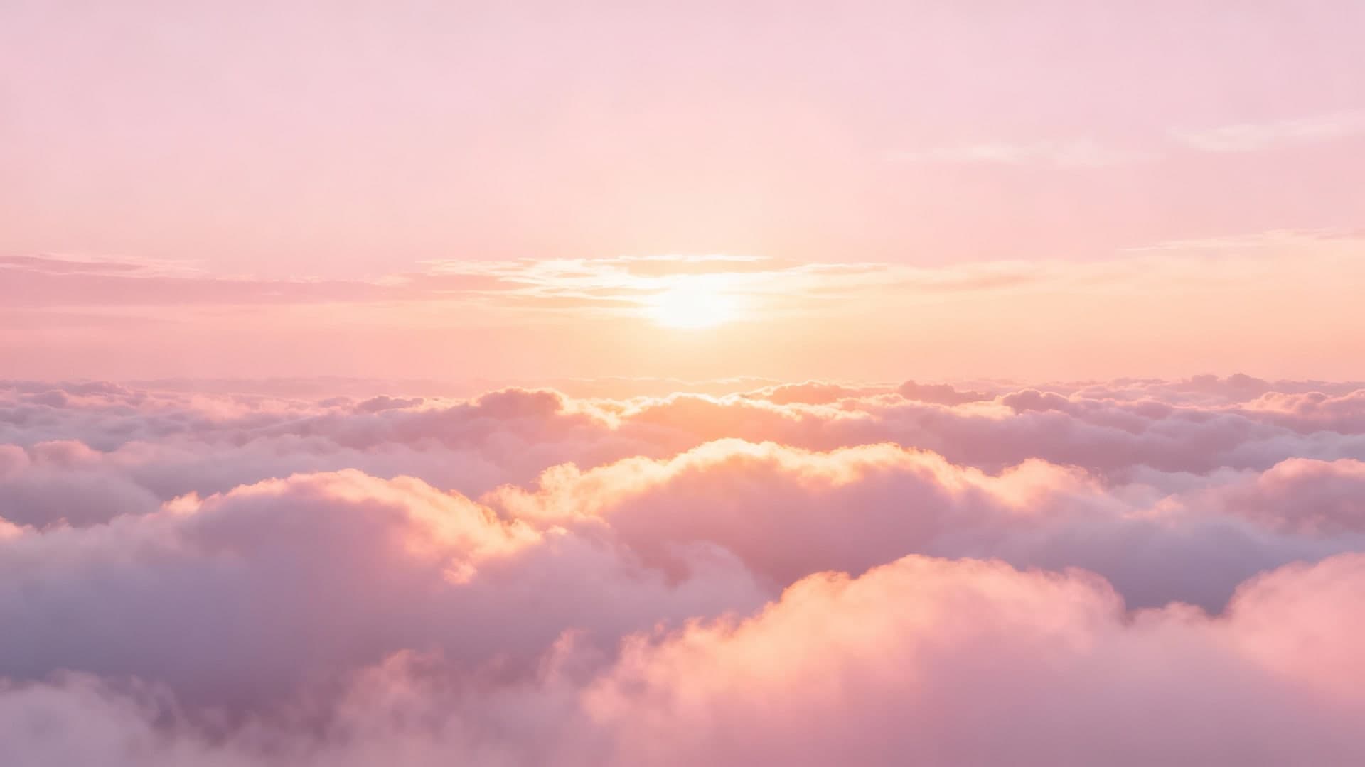 soft pink clouds glowing under morning sunlight
